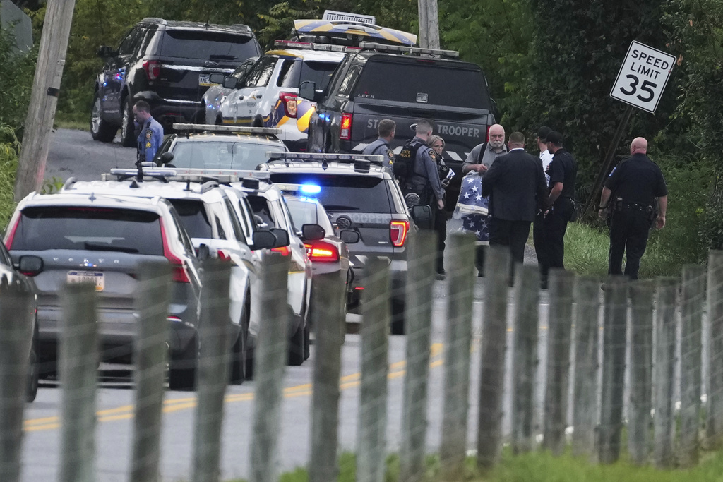 First responders work the scene after several people were injured during a shooting involving police officers on Wednesday, Sept. 17, 2025, in North Codorus, Pa. (AP Photo/Matt Slocum)