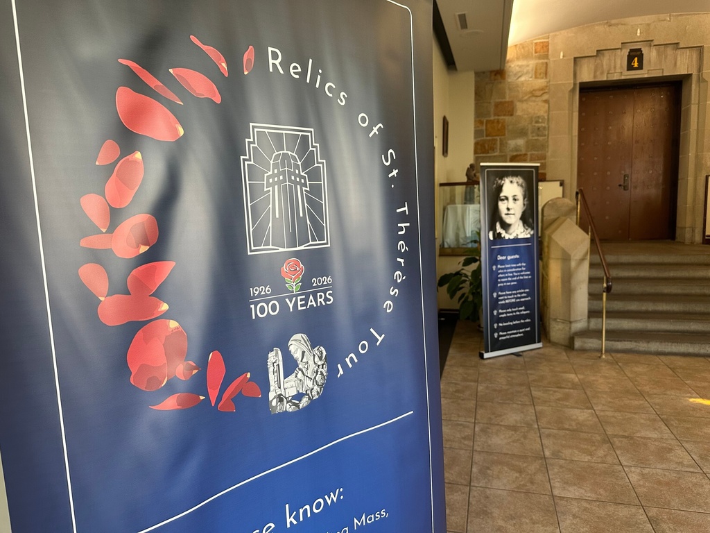 A sign welcomes visitors to the Relics of St. Thérèse Tour inside the National Shrine of The Little Flower Basilica Tuesday, Sept. 30, 2025, in Royal Oak, Mich. (AP Photo/Mike Householder)