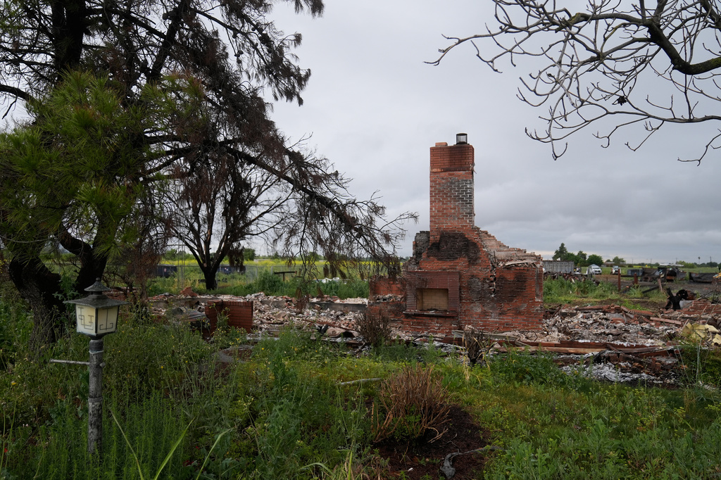 Property damage is shown at the location of a July 1, 2025, fireworks explosion in Esparto, Calif., Friday, April 10, 2026. (AP Photo/Jeff Chiu)