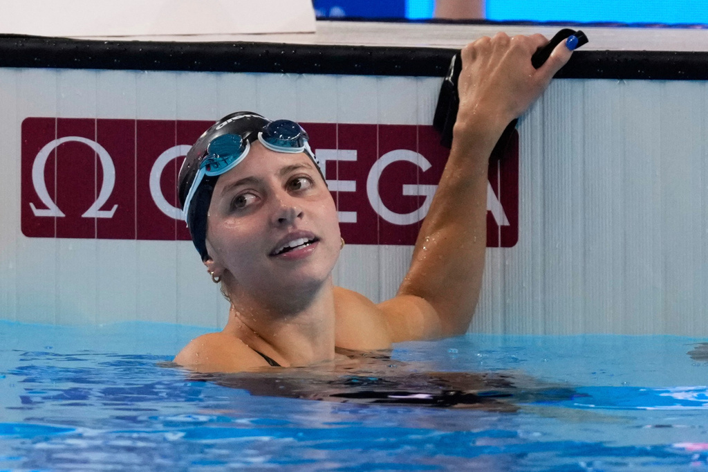 FILE -Kate Douglass of the United States reacts after winning gold medal in the women's 200-meter breaststroke final at the World Aquatics Championships in Singapore, Friday, Aug.1, 2025. (AP Photo/Vincent Thian, File)