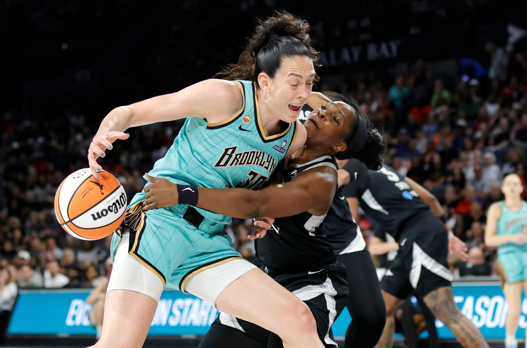 Las Vegas Aces guard Chelsea Gray knocks the ball away from New York Liberty forward Breanna Stewart (30) during the first half of an WNBA basketball game Tuesday, June 23, 2026, in Las Vegas. (Steve Marcus/Las Vegas Sun via AP)