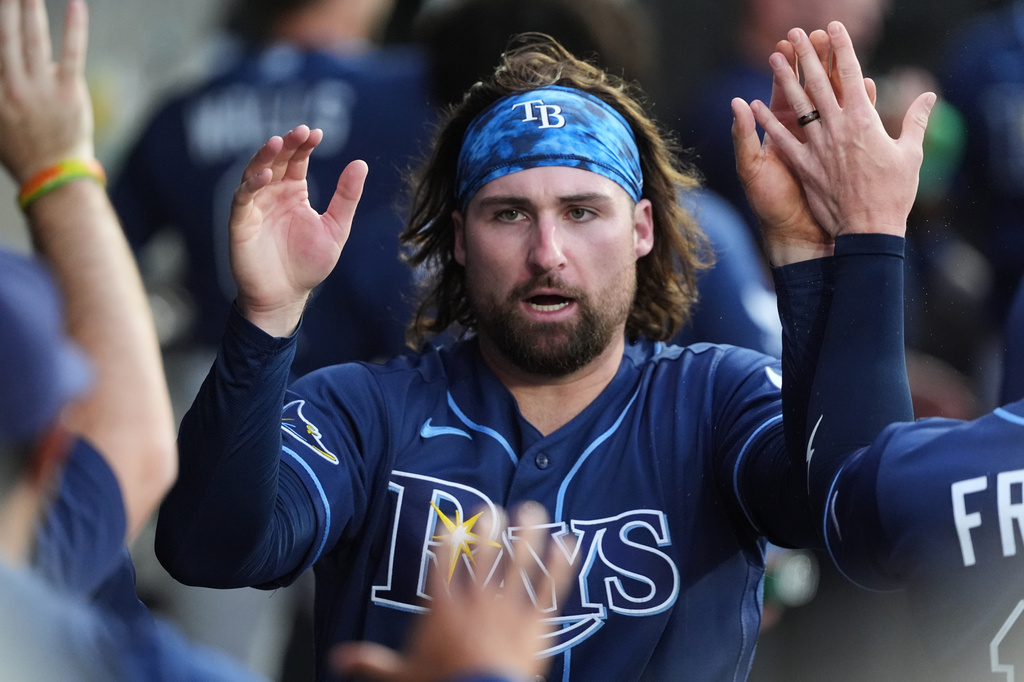 Tampa Bay Rays' Ryan Vilade celebrates with teammates after scoring on a throwing error by Chicago White Sox starting pitcher Noah Schultz during the first inning of a baseball game in Chicago, Tuesday, April 14, 2026. (AP Photo/Nam Y. Huh)