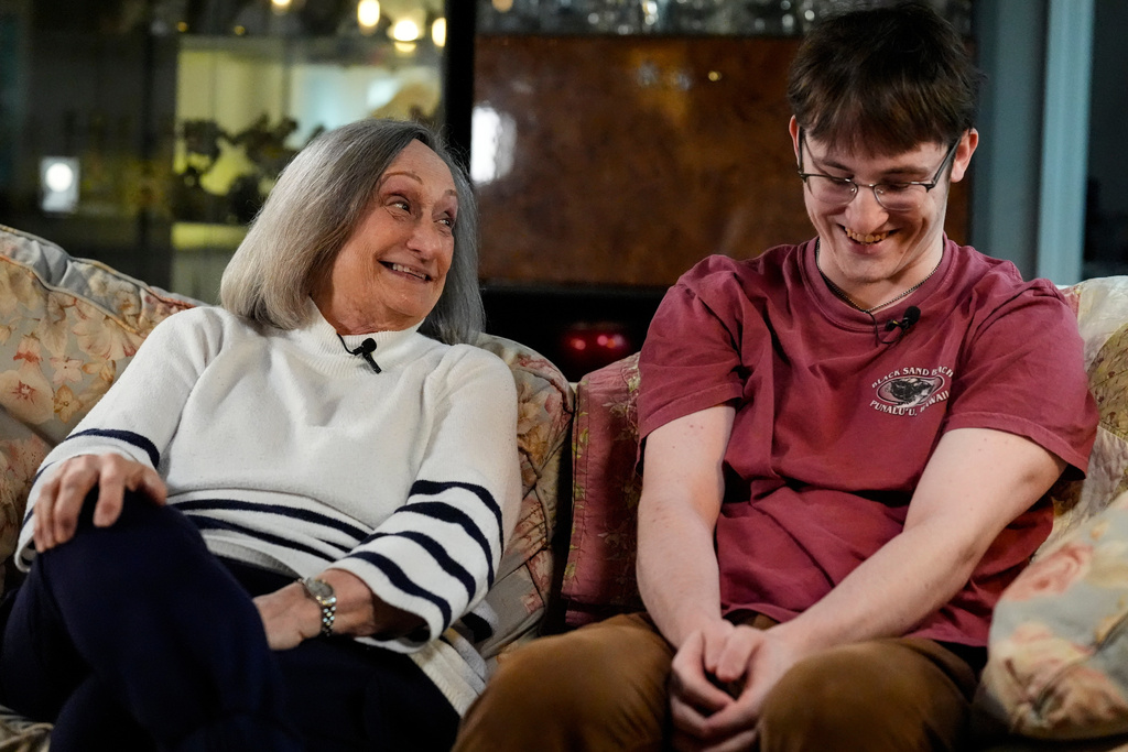 CORRECTS FIRST NAME TO DIANE - Diane West sits with her grandson Paul Quirk as they speak to a reporter, Tuesday, Dec. 2, 2025, in Marietta, Ga. (AP Photo/Mike Stewart)