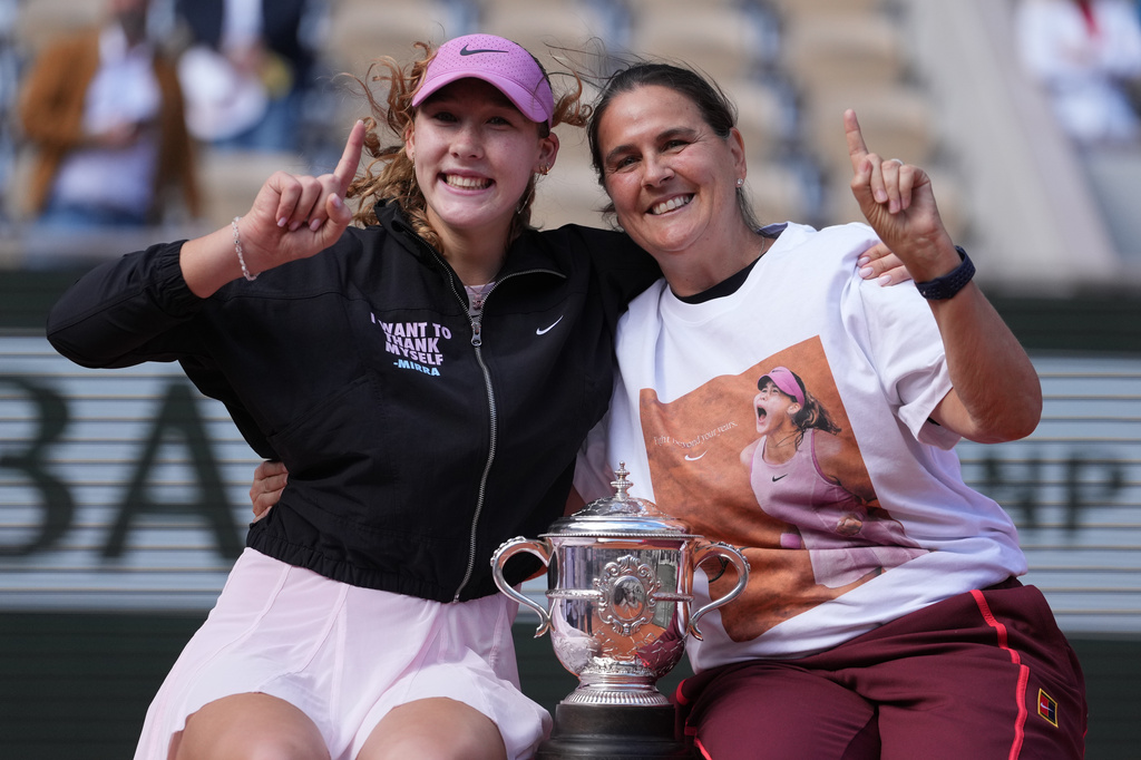 Russia's Mirra Andreeva poses with her coach Conchita Martinez after winning the final tennis match at the French Open in Paris, Saturday, June 6, 2026. (AP Photo/Thibault Camus)