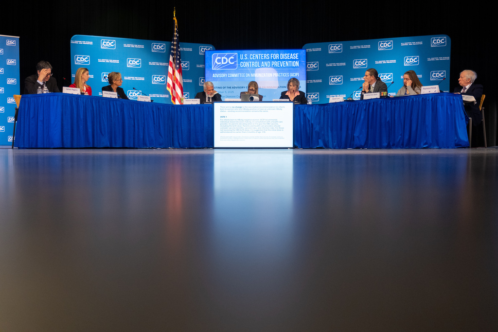 The CDC Advisory Committee on Immunization Practices votes to recommend changes to the infant hepatitis B vaccination policy during a meeting in Atlanta on Friday, Dec. 5, 2025. (AP Photo/Ben Gray)