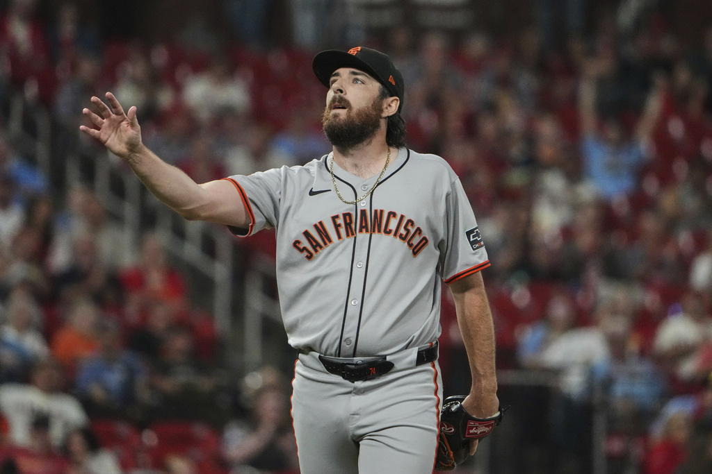 San Francisco Giants pitcher Ryan Walker reacts after hitting St. Louis Cardinals' Jimmy Crooks with a pitch to load the bases during the ninth inning of a baseball game Saturday, Sept. 6, 2025, in St. Louis. (AP Photo/Jeff Roberson)