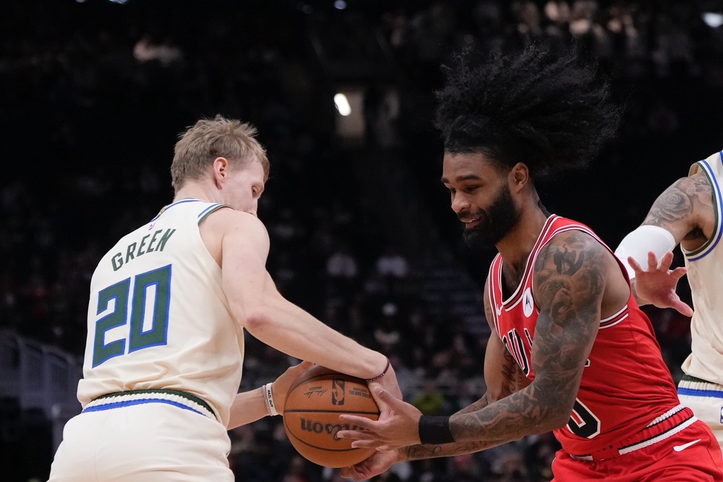 Th20 steals the ball from Chicago Bulls' Coby White during the first half of an NBA basketball game Tuesday, Feb. 3, 2026, in Milwaukee. (AP Photo/Morry Gash)