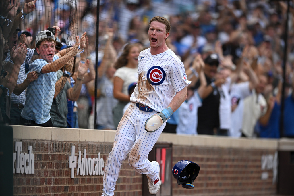 Chicago Cubs' Pete Crow-Armstrong celebrates after scoring the winning run on a throwing error by Toronto Blue Jays catcher Brandon Valenzuela during the eleventh inning of a baseball game in Chicago, Thursday, Aug. 6, 2026. (AP Photo/Paul Beaty)