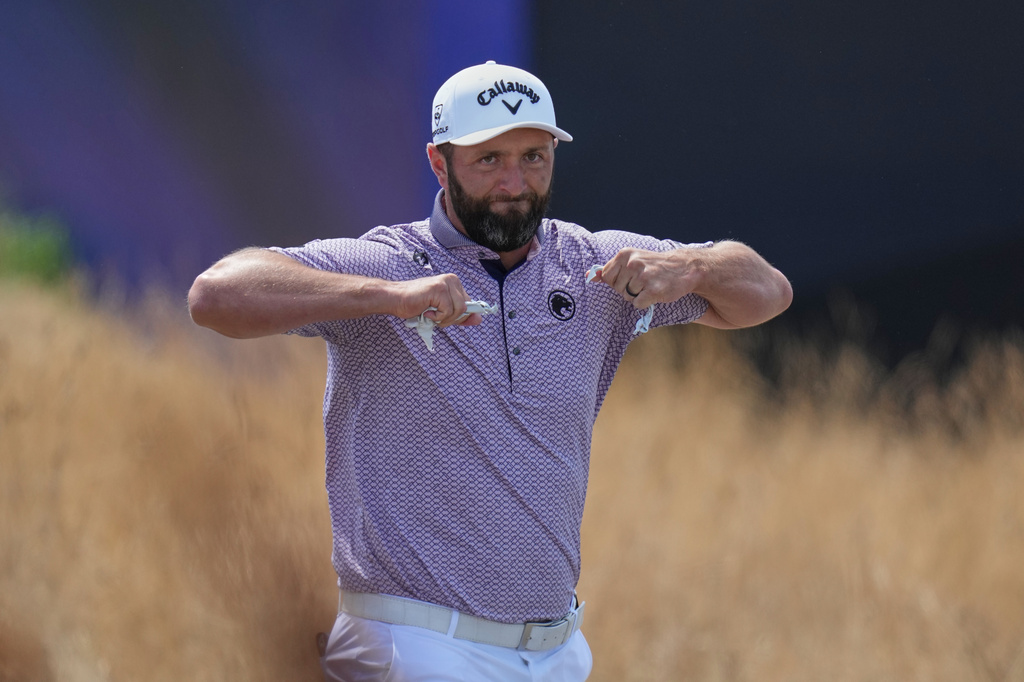 Jon Rahm of Spain gestures as he walks off the 1st tee during the final day of the British Open Golf championships at Royal Birkdale golf club, in Southport, England, Sunday, July 19, 2026. (AP Photo/Jon Super)