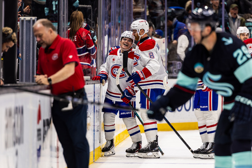 Montreal Canadiens right wing Cole Caufield, left, celebrates with defenseman Mike Matheson after scoring a goal during overtime of an NHL hockey game against the Seattle Kraken, Tuesday, Oct. 28, 2025, in Seattle. (AP Photo/Maddy Grassy) Montreal Canadiens right wing Cole Caufield, left, celebrates with defenseman Mike Matheson after scoring a goal during overtime of an NHL hockey game against the Seattle Kraken, Tuesday, Oct. 28, 2025, in Seattle. (AP Photo/Maddy Grassy)