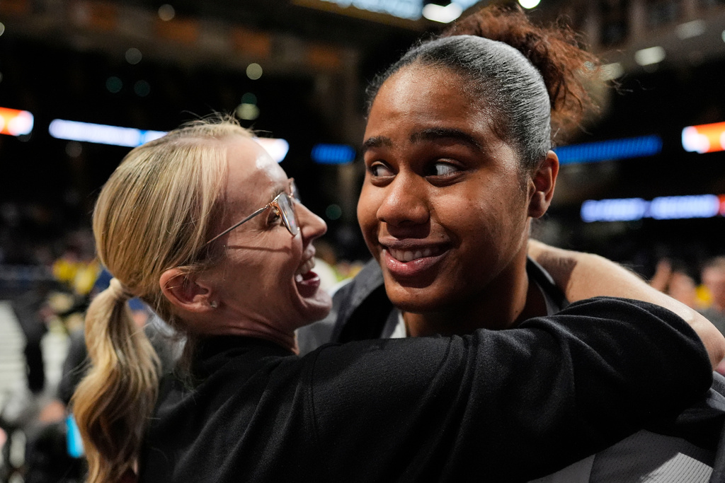 Vanderbilt head coach Shea Ralph celebrates with center Aalyah Del Rosario, right, after winning against Illinois in the second round of the NCAA college basketball tournament Monday, March 23, 2026, in Nashville, Tenn. (AP Photo/George Walker IV)