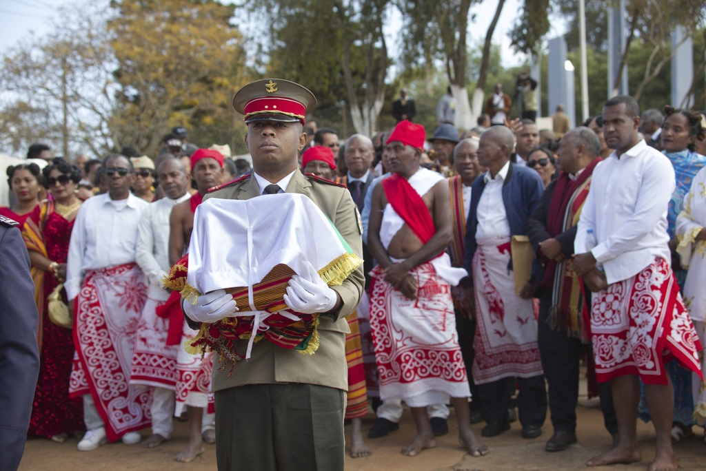 Madagascar security servicemen carry the three Sakalava skulls Tuesday, Sept. 2, 2025, in Antananarivo, Madagascar, after they were returned from France where they had been kept for 128 years. (AP Photo/Alexander Joe)