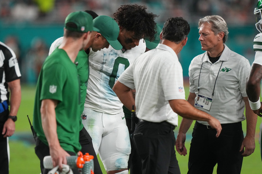 New York Jets running back Braelon Allen (0) walks off the field with team staff after suffering an unknown injury in the first half of an NFL football game against the Miami Dolphins, Monday, Sept. 29, 2025, in Miami Gardens, Fla. (AP Photo/Marta Lavandier) New York Jets running back Braelon Allen (0) walks off the field with team staff after suffering an unknown injury in the first half of an NFL football game against the Miami Dolphins, Monday, Sept. 29, 2025, in Miami Gardens, Fla. (AP Photo/Marta Lavandier)