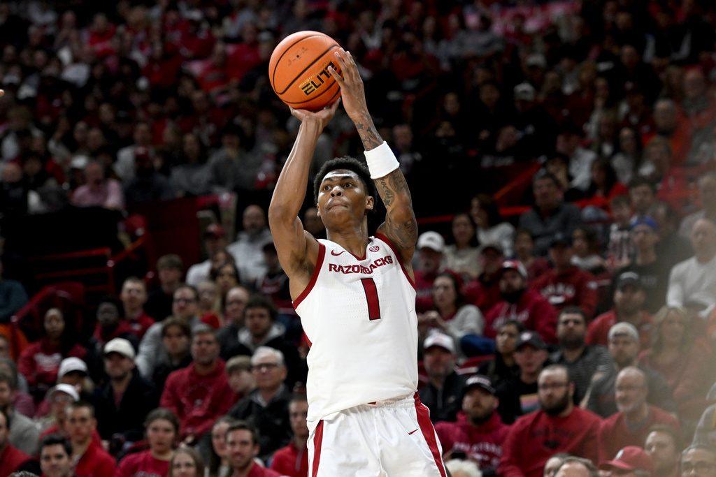 Arkansas guard Meleek Thomas pulls up to shoot a 3-point basket against James Madison during an NCAA college basketball game Monday, Dec. 29, 2025, in Fayetteville, Ark. (AP Photo/Michael Woods)