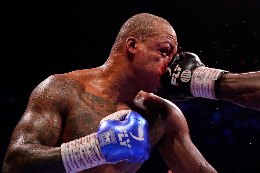 Britain's Fabio Wardley takes a punch to the face from Britain's Daniel Dubois during their WBO World Heavyweight boxing title bout in Manchester, Saturday, May 9, 2026. (AP Photo/Dave Thompson)