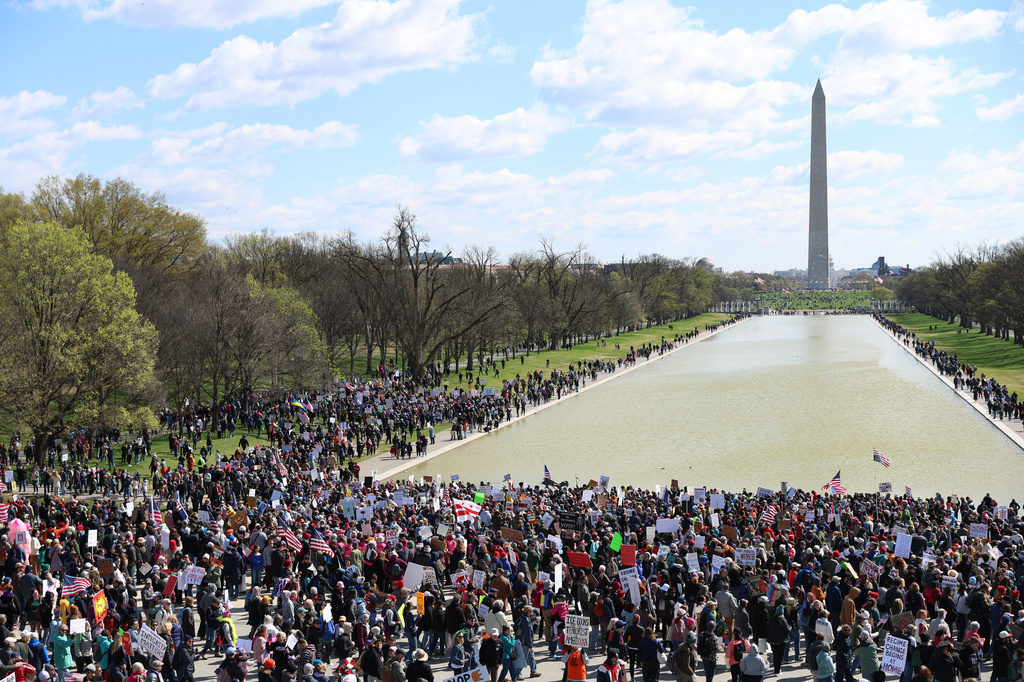 EDS NOTE: OBSCENITY - Demonstrators rally in front of the Lincoln Memorial during the No Kings protest in Washington, Saturday, March 28, 2026. (AP Photo/Tom Brenner)