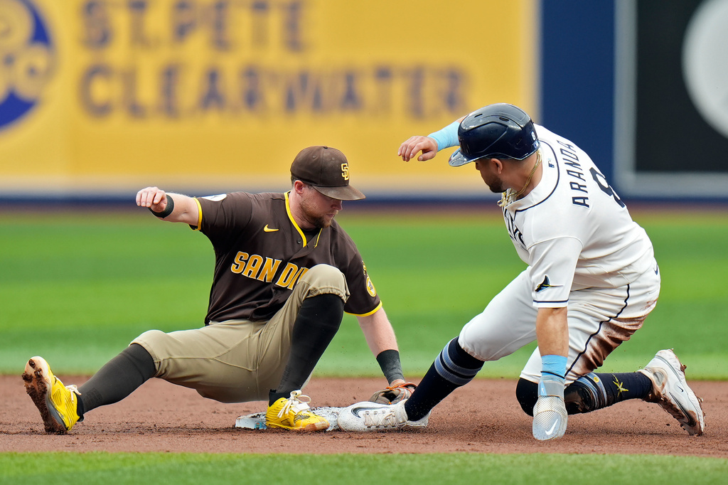 San Diego Padres second baseman Jake Cronenworth, left, tags out Tampa Bay Rays' Jonathan Aranda attempting to steals second during the first inning of a baseball game Sunday, Aug. 30, 2026, in St. Petersburg, Fla. (AP Photo/Chris O'Meara)
