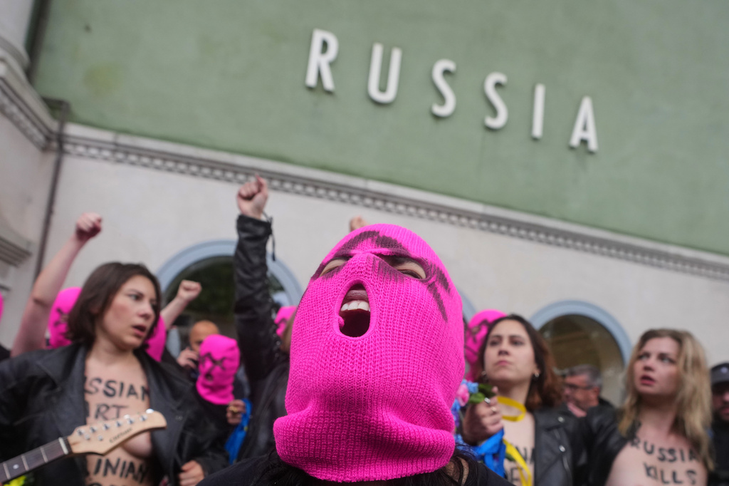 Pussy Riot and FEMEN activists stage a protest against Russia's presence after its absence following the 2022 invasion of Ukraine in front of the Russian pavilion, at the 2026 Art Venice Biennale, in Venice, Italy, Wednesday, May 6, 2026. (AP Photo/Luca Bruno)