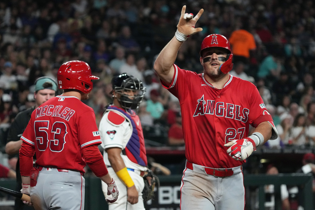 Los Angeles Angels' Mike Trout (27) reacts after hitting a solo home run against the Arizona Diamondbacks in the fifth inning of a baseball game, Monday, June 15, 2026, in Phoenix. (AP Photo/Rick Scuteri)