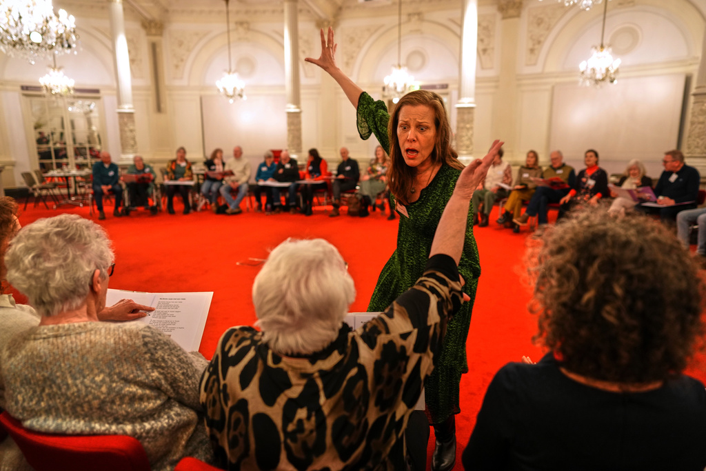 People many of them seniors with a form of dementia, join in the "singing circle" run by opera singer Maartje de Lint at the Concertgebouw's ornate Mirror Hall in Amsterdam, on Feb. 24, 2026. (AP Photo/Peter Dejong)