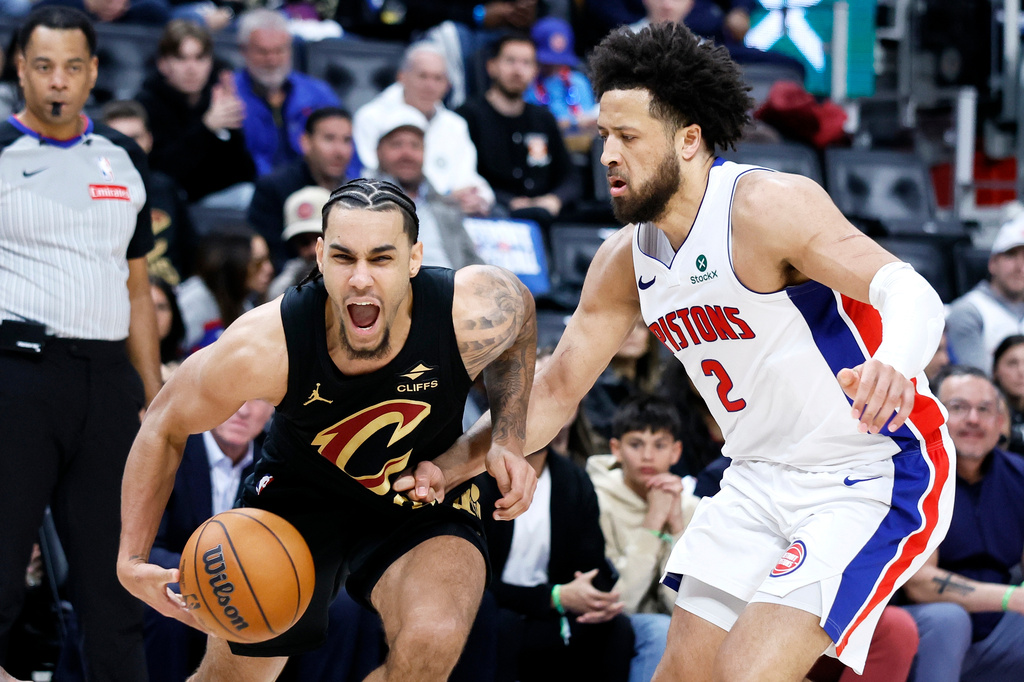 Cleveland Cavaliers guard Jaylon Tyson, left, drives against Detroit Pistons guard Cade Cunningham (2) during the first half in Game 2 of a second-round NBA playoffs basketball series, Thursday, May 7, 2026, in Detroit. (AP Photo/Duane Burleson)