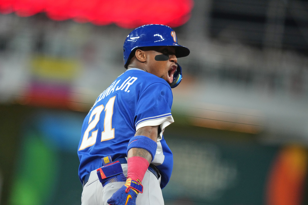 Venezuela's Ronald Acuna Jr. celebrates his single home run during the first inning of a World Baseball Classic quarterfinal game, Saturday, March 14, 2026, in Miami. (AP Photo/Lynne Sladky)