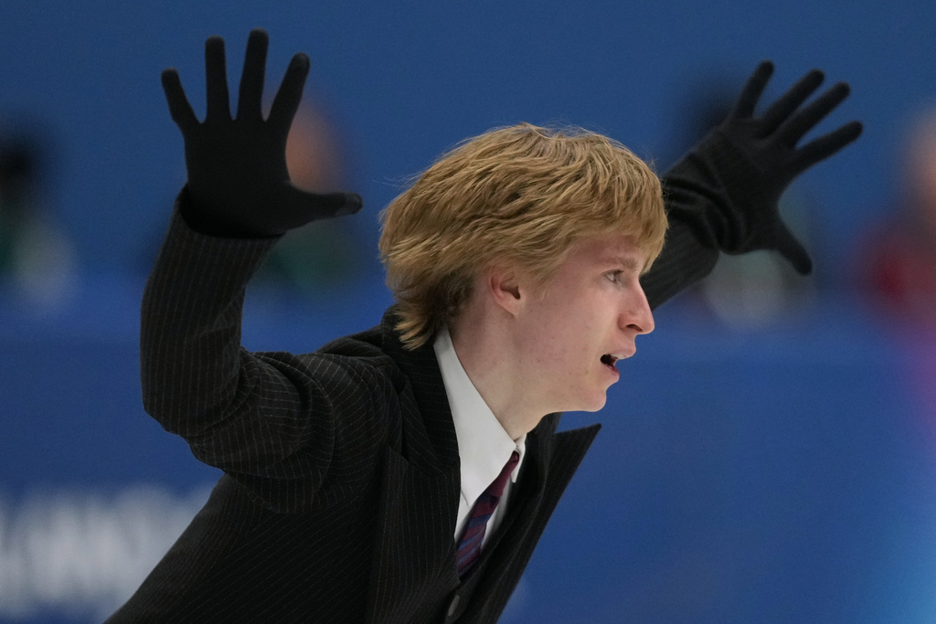 Stephen Gogolev of Canada competes during the figure skating men's team event at the 2026 Winter Olympics, in Milan, Italy, Saturday, Feb. 7, 2026. (AP Photo/Natacha Pisarenko)