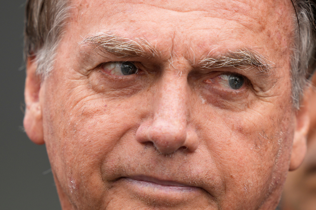 FILE - Former President Jair Bolsonaro, temporarily allowed out of house arrest for medical treatment, departs a hospital in Brasilia, Brazil, Sept. 14, 2025. (AP Photo/Eraldo Peres, File)