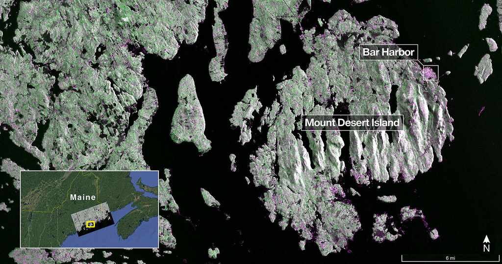 In this image provided by NASA/JPL-Caltech captured on Aug. 21, 2025, NISAR’s L-band radar shows Maine’s Mount Desert Island, green indicates forest; magenta represents hard or regular surfaces, like bare ground and buildings. The magenta area on the island’s northeast end is the town of Bar Harbor. (NASA/JPL-Caltech via AP)