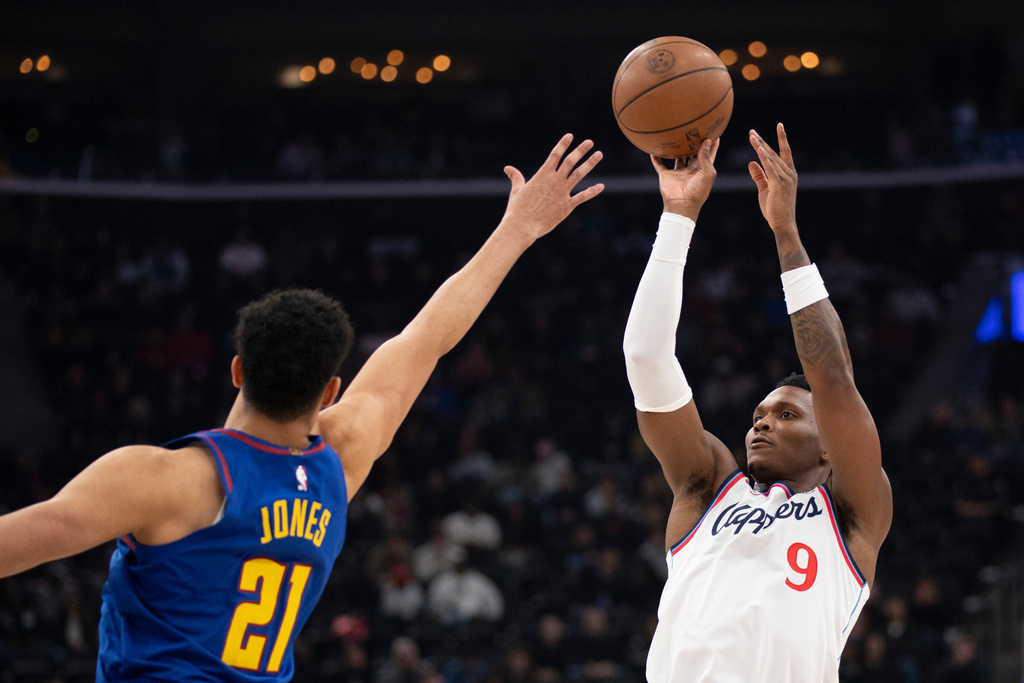 Los Angeles Clippers guard Bennedict Mathurin (9) shoots over Denver Nuggets forward Spencer Jones (21) during the first half of an NBA basketball game Thursday, Feb. 19, 2026, in Inglewood, Calif. (AP Photo/Kyusung Gong)