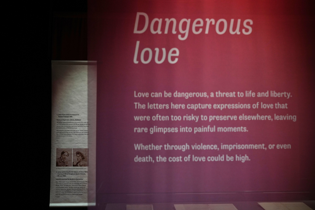 A general view of part of the Love Letters exhibition at the National Archives, with pictures of the writer Oscar Wilde and Lord Alfred Douglas, in London, Wednesday, Jan. 21, 2026. (AP Photo/Alastair Grant)