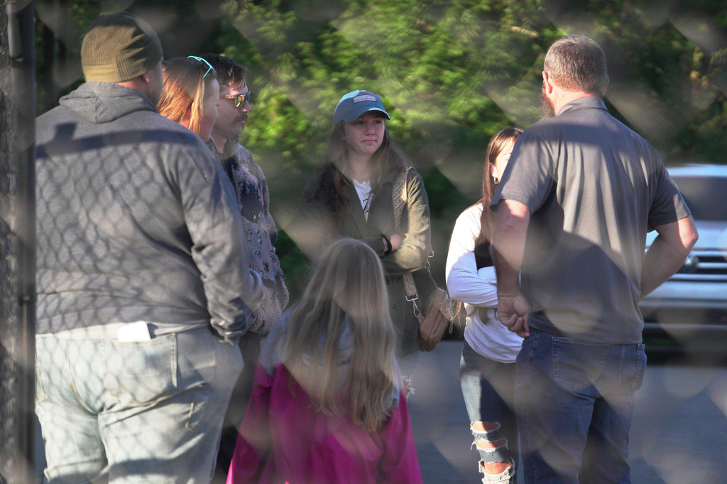 Family members gather at Accurate Energetic Systems, an explosive plant, after a blast on Friday resulted in multiple fatalities and several missing on Saturday, Oct 11, 2025, in Bucksnort, Tenn. (AP photo/ Obed Lamy)
