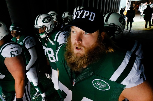 FILE - New York Jets center Nick Mangold (74) wears an NYPD hat as he waits to go on the field for the start of an NFL football game against the New England Patriots, Sunday, Dec. 21, 2014, in East Rutherford, N.J. (AP Photo/Julio Cortez, File) FILE - New York Jets center Nick Mangold (74) wears an NYPD hat as he waits to go on the field for the start of an NFL football game against the New England Patriots, Sunday, Dec. 21, 2014, in East Rutherford, N.J. (AP Photo/Julio Cortez, File)