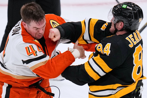Boston Bruins left wing Tanner Jeannot (84) lands a punch in a fight against Anaheim Ducks left wing Ross Johnston (44) during the second period of an NHL hockey game, Thursday, Oct. 23, 2025, in Boston. (AP Photo/Charles Krupa) Boston Bruins left wing Tanner Jeannot (84) lands a punch in a fight against Anaheim Ducks left wing Ross Johnston (44) during the second period of an NHL hockey game, Thursday, Oct. 23, 2025, in Boston. (AP Photo/Charles Krupa)