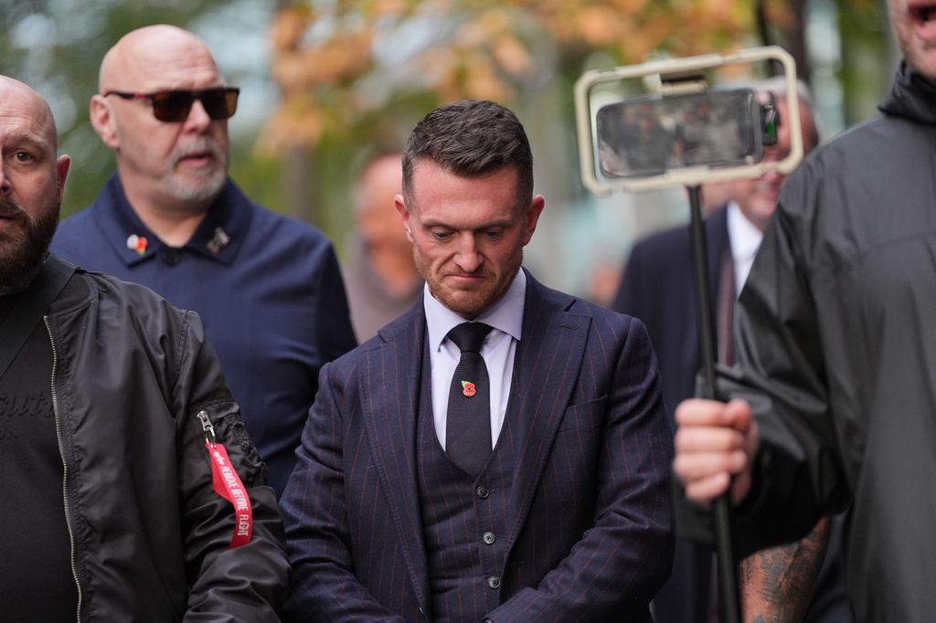 Stephen Yaxley-Lennon, the far-right British activist also known as Tommy Robinson, departs Southwark Crown Court in south London, after he was found guilty of harassing journalists Wednesday, Oct. 28, 2026. (Yui Mok/PA via AP)