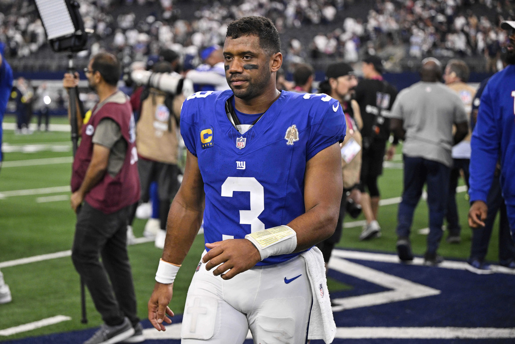 New York Giants quarterback Russell Wilson (3) walks off the field after the team's overtime loss in an NFL football game against the Dallas Cowboys Sunday, Sept. 14, 2025, in Arlington, Texas. (AP Photo/Jerome Miron)