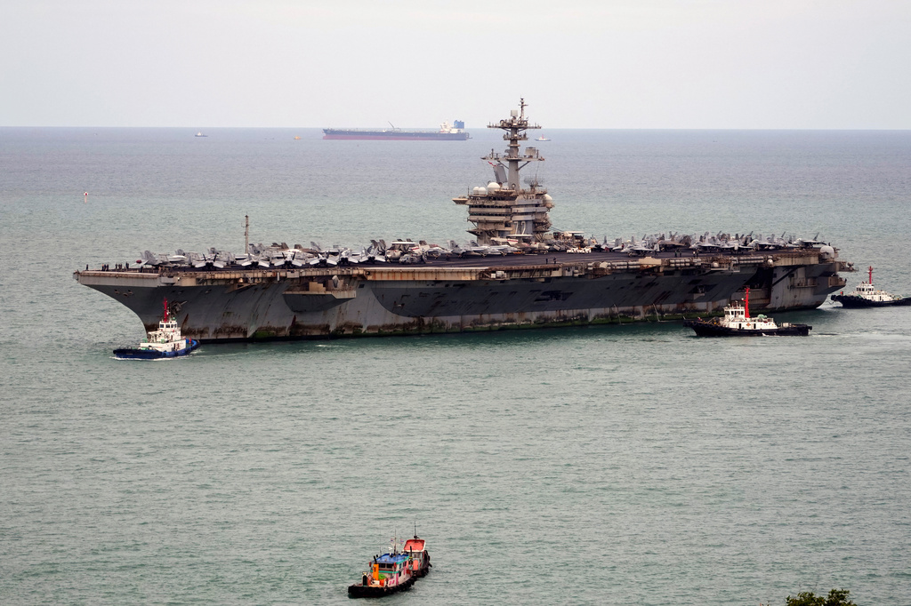 Tug boats greet the U.S. Navy aircraft carrier USS Abraham Lincoln as it arrives at the port in Laem Chabang, Chonburi, Thailand, Wednesday, Sept. 2, 2026. (AP Photo/Sakchai Lalit)