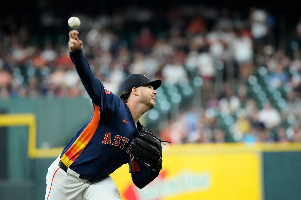 Houston Astros starting pitcher Peter Lambert throws against the Tampa Bay Rays during the first inning of a baseball game Sunday, July 5, 2026 in Houston. (AP Photo/David J. Phillip)
