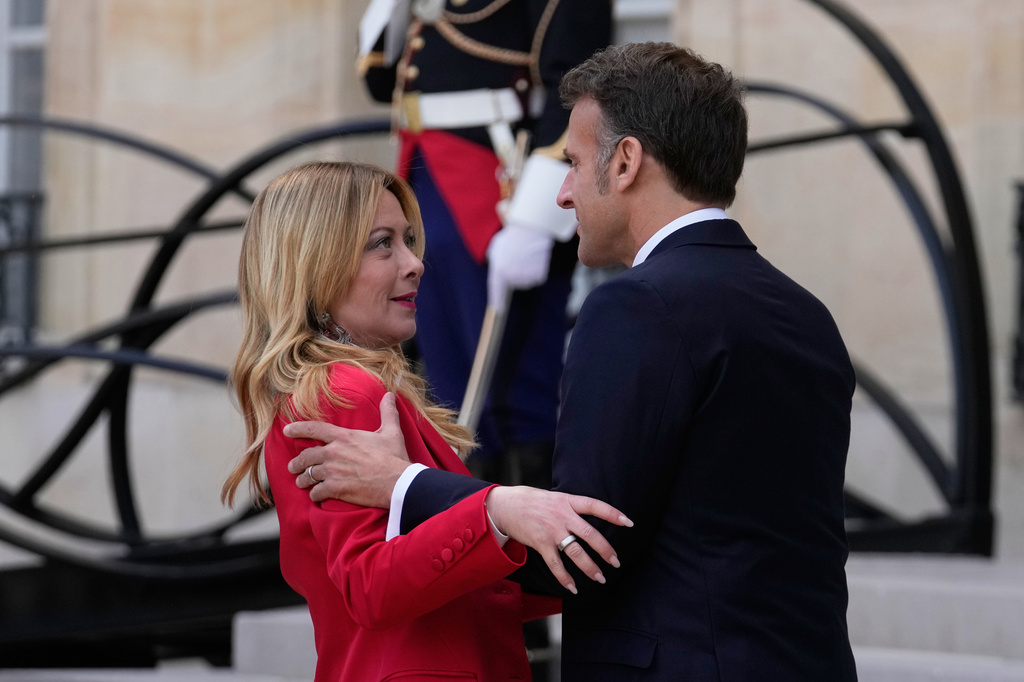 France's President Emmanuel Macron, right, welcomes Italian Premier Giorgia Meloni prior to an international summit to push forward efforts to reopen the Strait of Hormuz, at the Elysee Palace, in Paris, France, Friday, April 17, 2026. (AP Photo/Michel Euler)