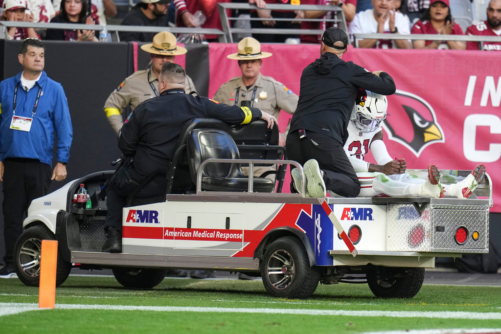 Arizona Cardinals cornerback Garrett Williams (21) is taken off the field due to injury against the Atlanta Falcons during the first half of an NFL football game, Sunday, Dec. 21, 2025, in Glendale, Ariz. (AP Photo/Rick Scuteri)