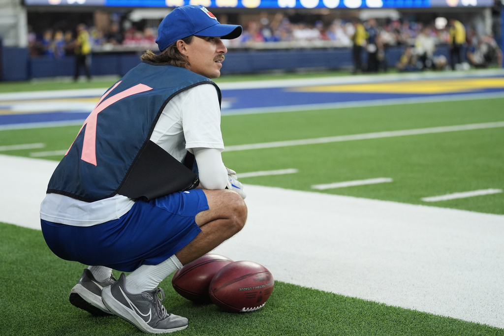 Special footballs used for kicks and punts are placed in front of a ball crew member during the first half of an NFL football game between the Los Angeles Rams and the San Francisco 49ers, Thursday, Oct. 2, 2025, in Inglewood, Calif. (AP Photo/Marcio Jose Sanchez)