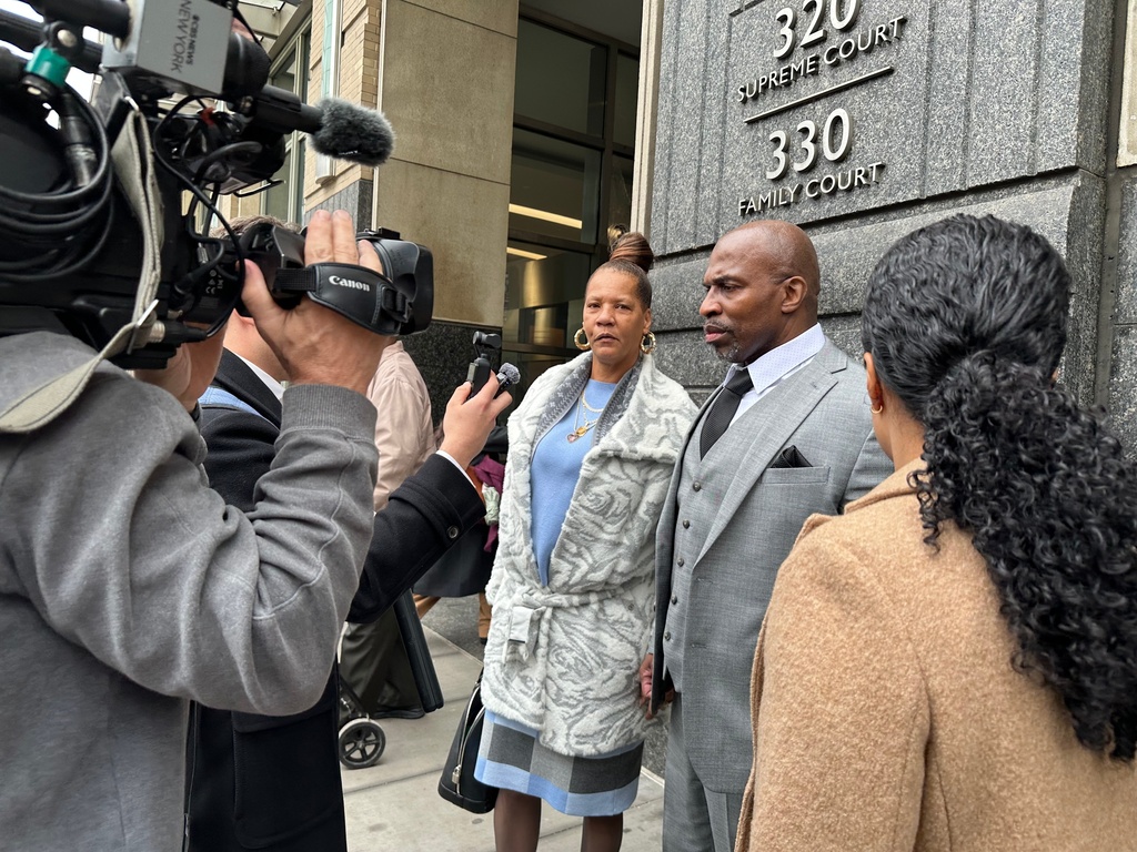 Kenneth Windley, right, speaks to reporters while accompanied by his fiancée, Donna Carter, outside the courthouse in the Brooklyn borough of New York, Monday, March 16, 2026. (AP Photo/Jennifer Peltz)