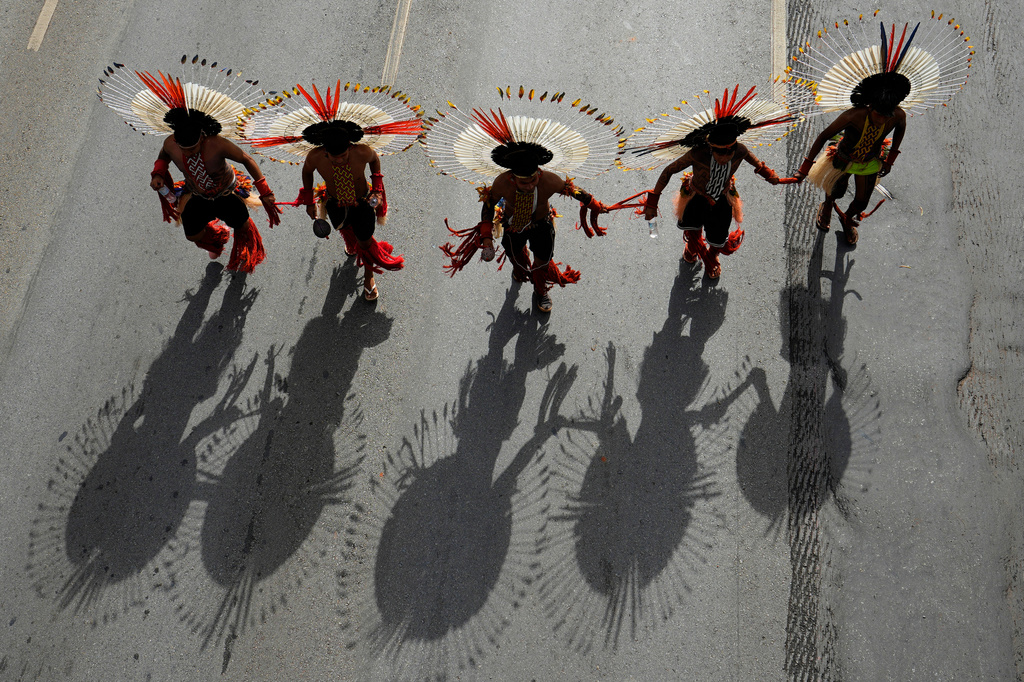 Karaja people take part in a march at the Acampamento Terra Livre 2026, an Indigenous mobilization focused on land rights and environmental protection, in Brasilia, Brazil, Thursday, April 9, 2026. (AP Photo/Eraldo Peres)
