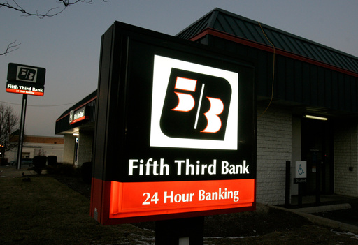 FILE - In this Jan. 21, 2009 file photo, signs outside a Fifth Third Bank are lit up at dusk in Cincinnati.(AP Photo/Al Behrman, file) FILE - In this Jan. 21, 2009 file photo, signs outside a Fifth Third Bank are lit up at dusk in Cincinnati.(AP Photo/Al Behrman, file)