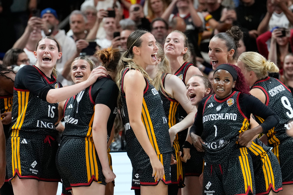 German players celebrate after the Women's Basketball World Cup quarterfinal match between Germany and Belgium in Berlin, Thursday, Sept. 10, 2026. (AP Photo/Ebrahim Noroozi)