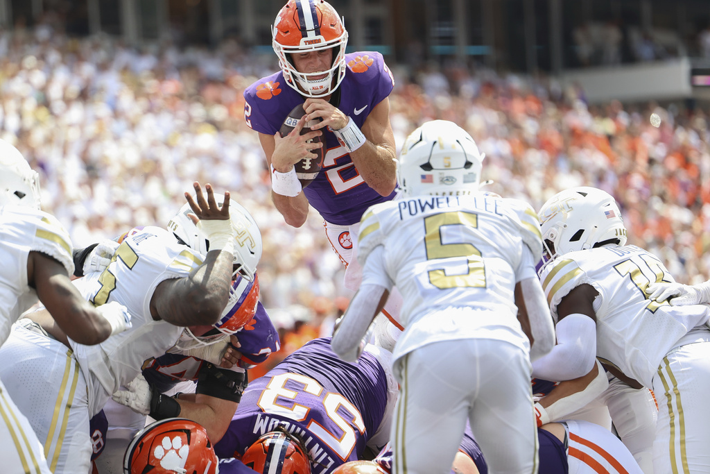 Clemson quarterback Cade Klubnik (2) dives over the goal line and scores a touchdown during the first half of an NCAA college football game against Georgia Tech, Saturday, Sept. 13, 2025, in Atlanta. (AP Photo/Colin Hubbard)