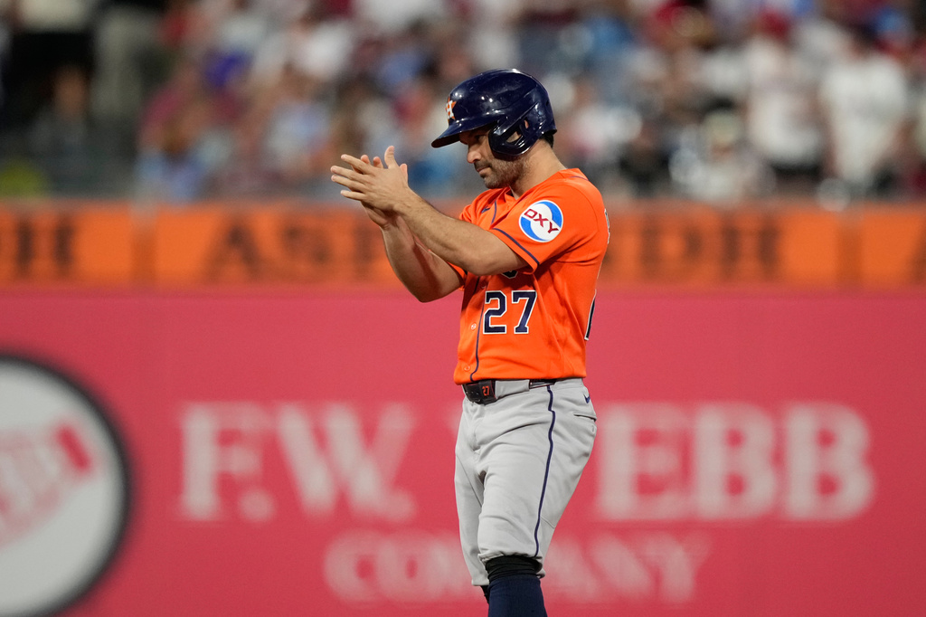 Houston Astros' Jose Altuve celebrates after hitting a double against Philadelphia Phillies pitcher Cristopher Sánchez for his 2,500th career hit during the third inning of a baseball game Wednesday, Sept. 9, 2026, in Philadelphia. (AP Photo/Matt Slocum)