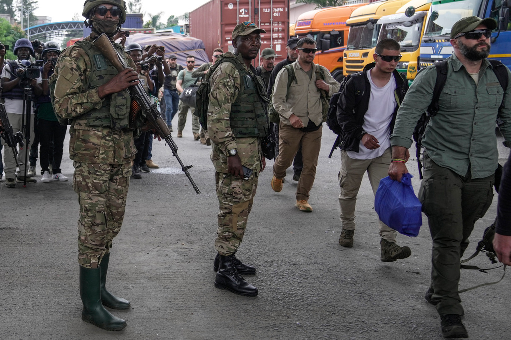 Willy Ngoma, spokesperson for the Rwanda-backed M23 rebels fighting in eastern Congo, center, releases captured mercenaries at the Gisenyi border point in eastern Democratic Republic of Congo, Wednesday, Jan. 29, 2025. Willy Ngoma was killed in a drone strike Tuesday Feb. 24, 2026. (AP Photo/Brian Inganga)