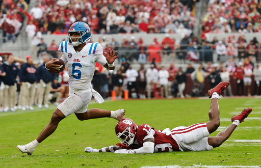 Mississippi quarterback Trinidad Chambliss (6) escapes a tackle by Oklahoma for a first down during the first half of an NCAA college football game in Norman, Okla., Saturday, Oct. 25, 2025. (AP Photo/Alonzo Adams) Mississippi quarterback Trinidad Chambliss (6) escapes a tackle by Oklahoma for a first down during the first half of an NCAA college football game in Norman, Okla., Saturday, Oct. 25, 2025. (AP Photo/Alonzo Adams)
