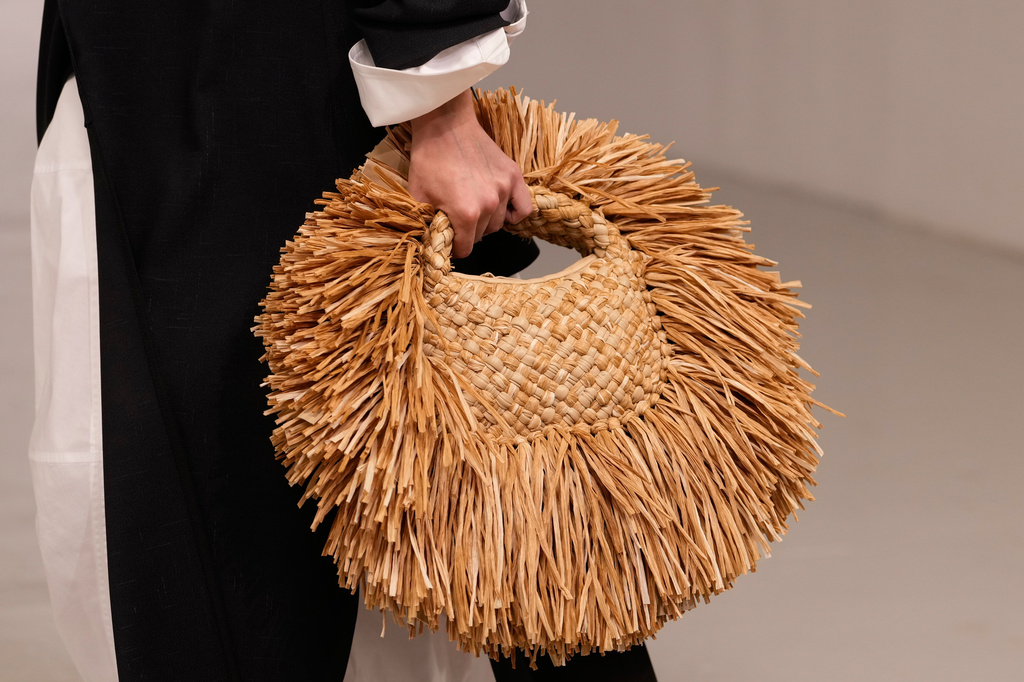 A model wears a creation part of the Bottega Veneta women's Spring-Summer 2027 collection, presented in Milan, Italy, Saturday, Sept. 26, 2026. (AP Photo/Luca Bruno)